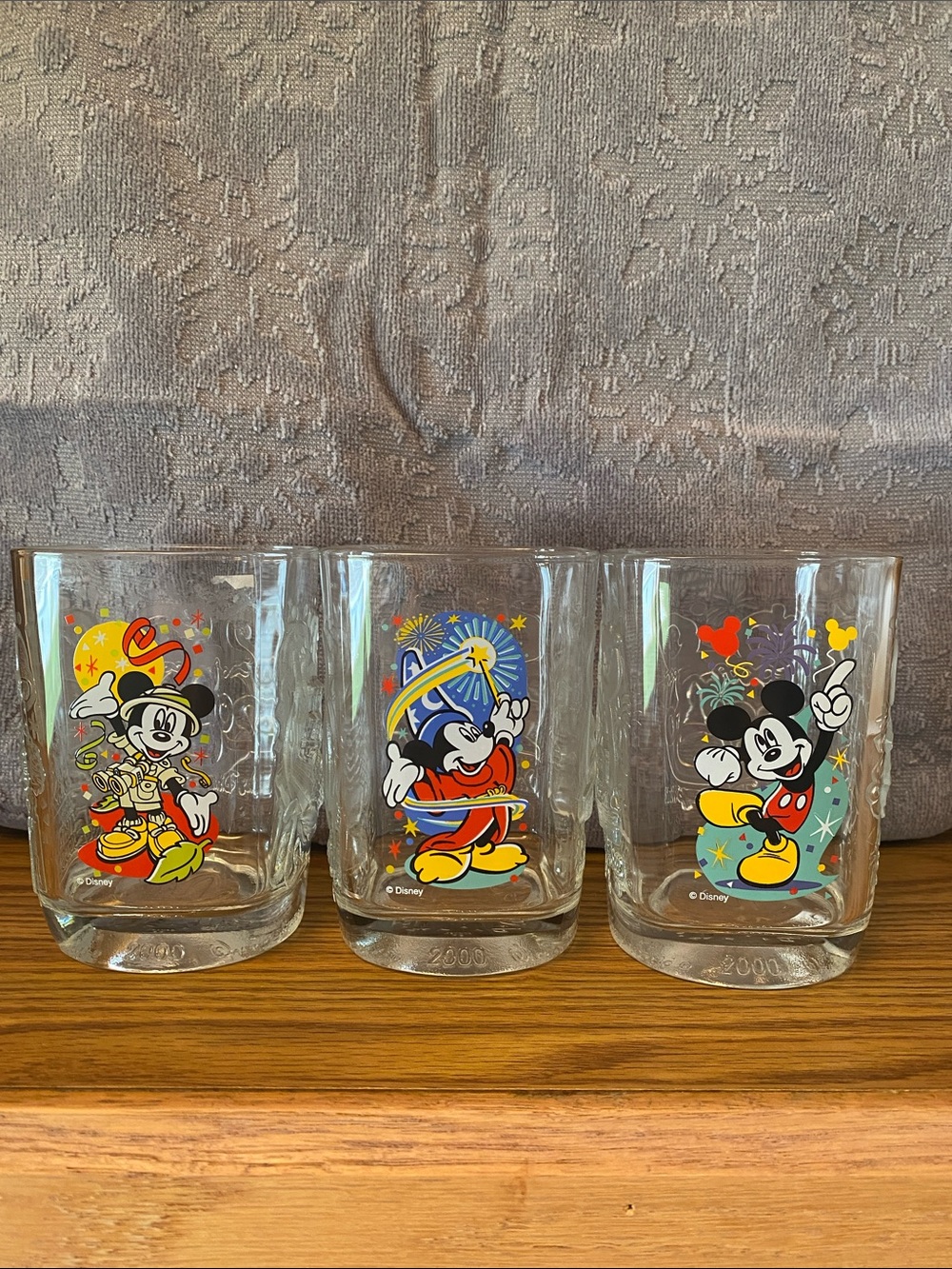 Three Disney glasses each featuring a vibrant Mickey Mouse Print.